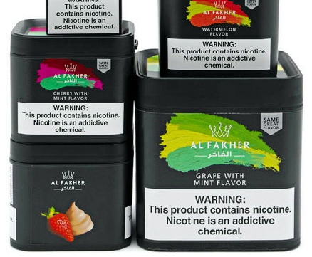 a group of black containers with different colors of different flavors