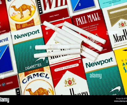 Cigarettes stacked in a pile, representing a stock image.